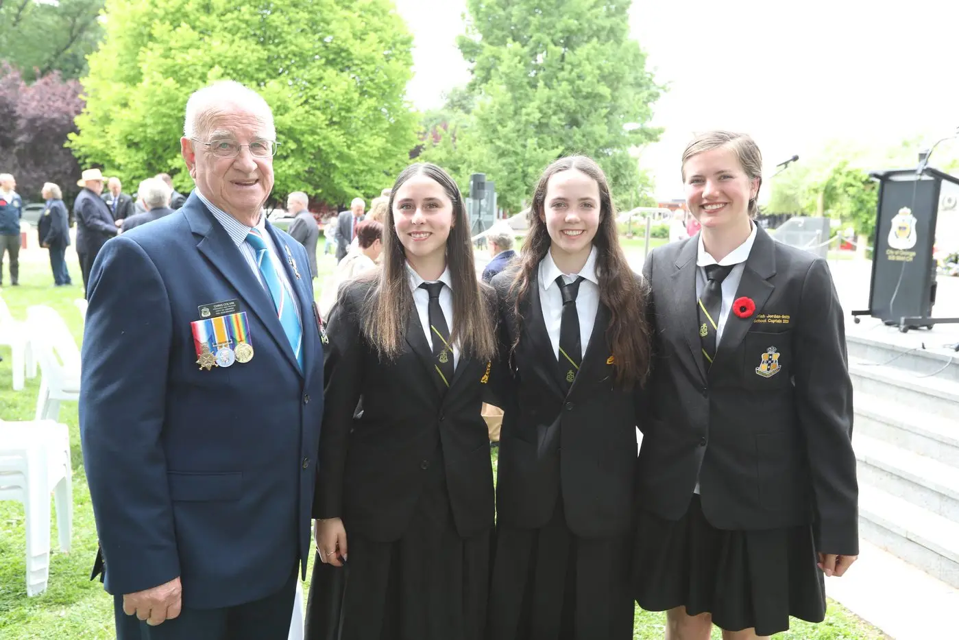 City of Orange RSL Sub-Branch President Chris Colvin, with Orange High School students Natalia Wisse, Sienna Flannery and Auriah Jordan-Smith