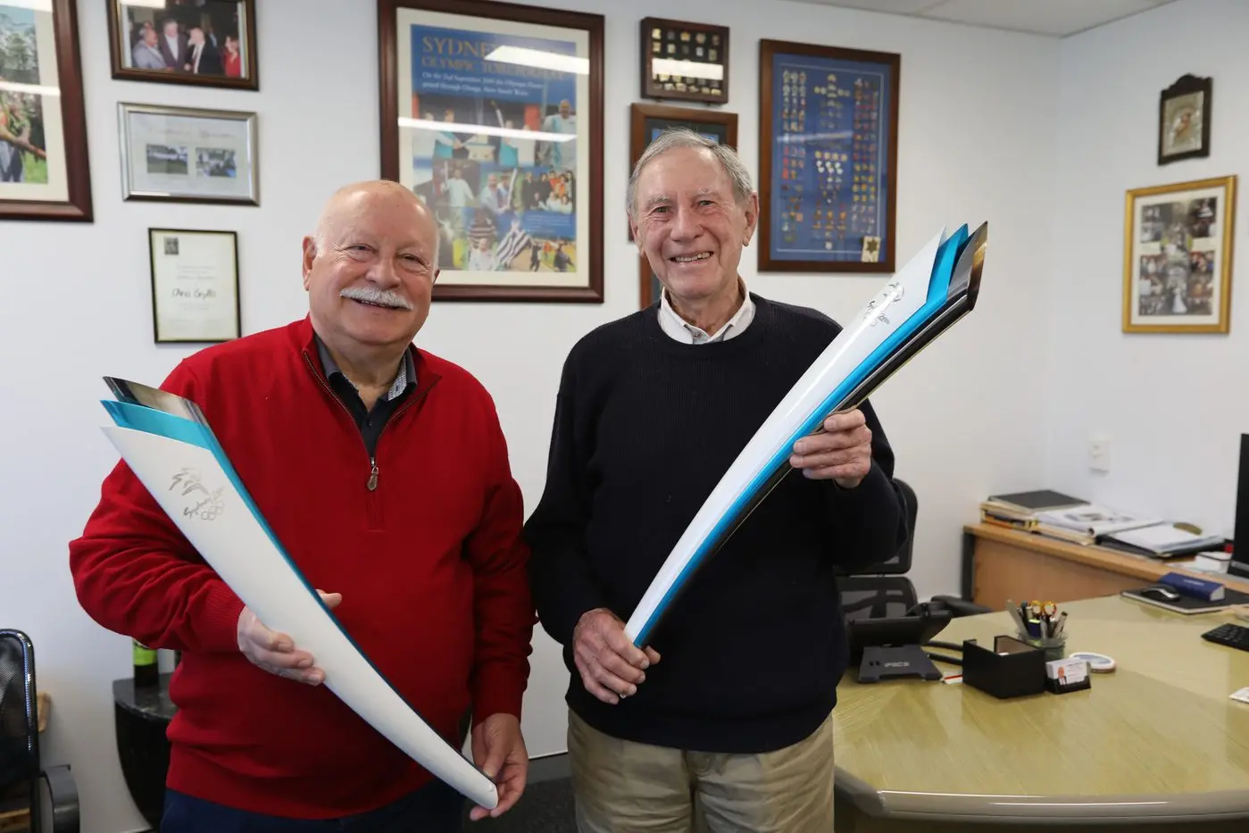 Olympic fever: With the Paris Olympics just a week away, Chris Gryllis and Graham Blore relive fond memories of carrying the Olympic torch ahead of the Sydney 2000 games.