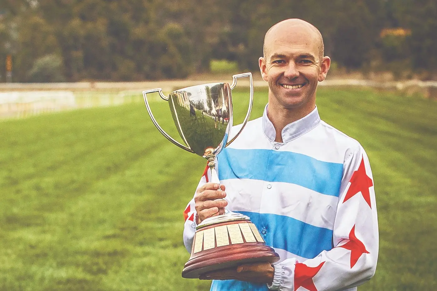 Winning jockey Keagan Latham with the 2024 Orange Gold Cup after he rode Pireaus to victory. Photo: Janian McMillan (racingphotography.com.au)