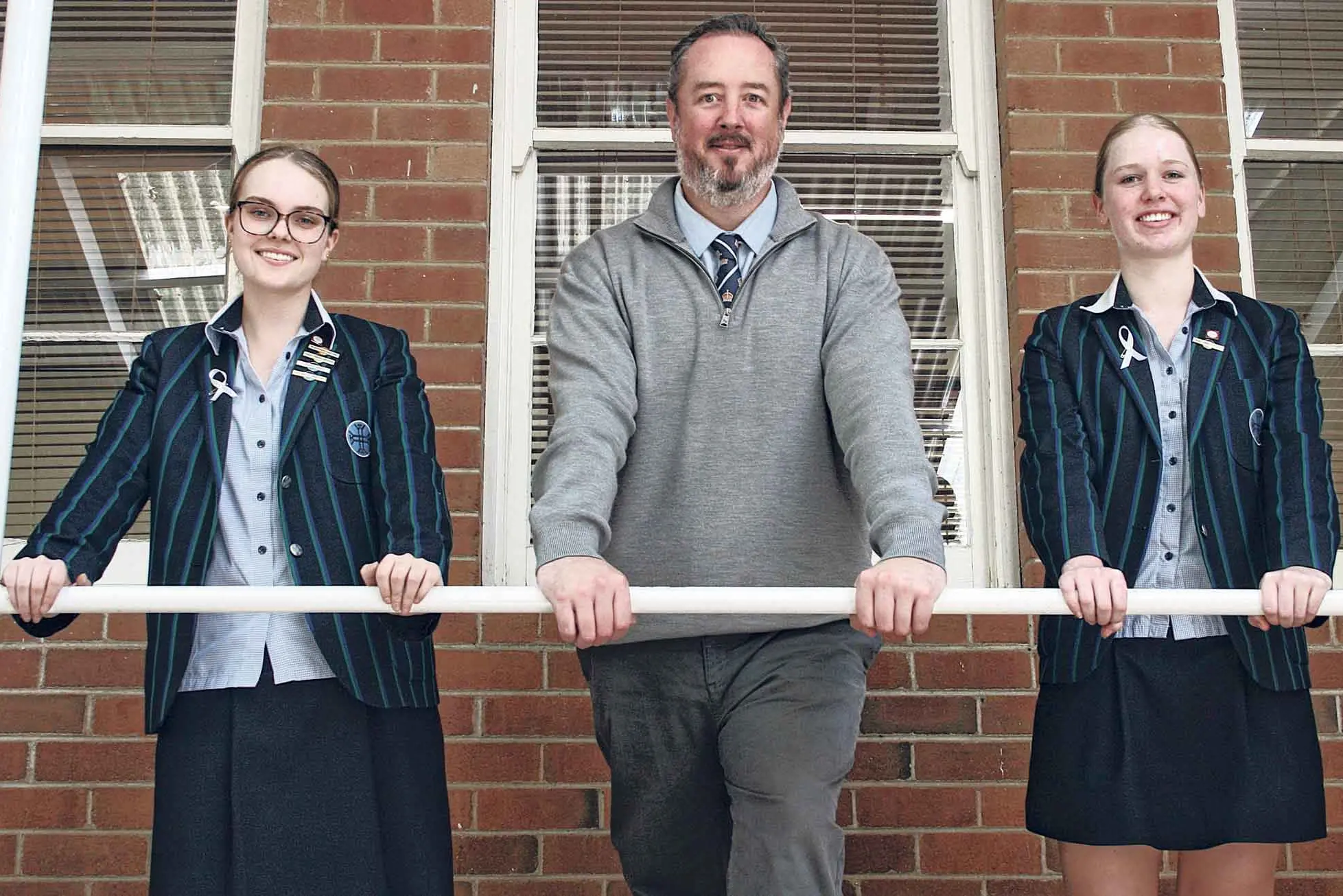 <p>Pitching in for their first respite camp for children with special needs next month are Kinross Wolaroi students Abbey Cunial and Molly Mason, with school coordinator, Mr Alex McLennan.</p>\\n