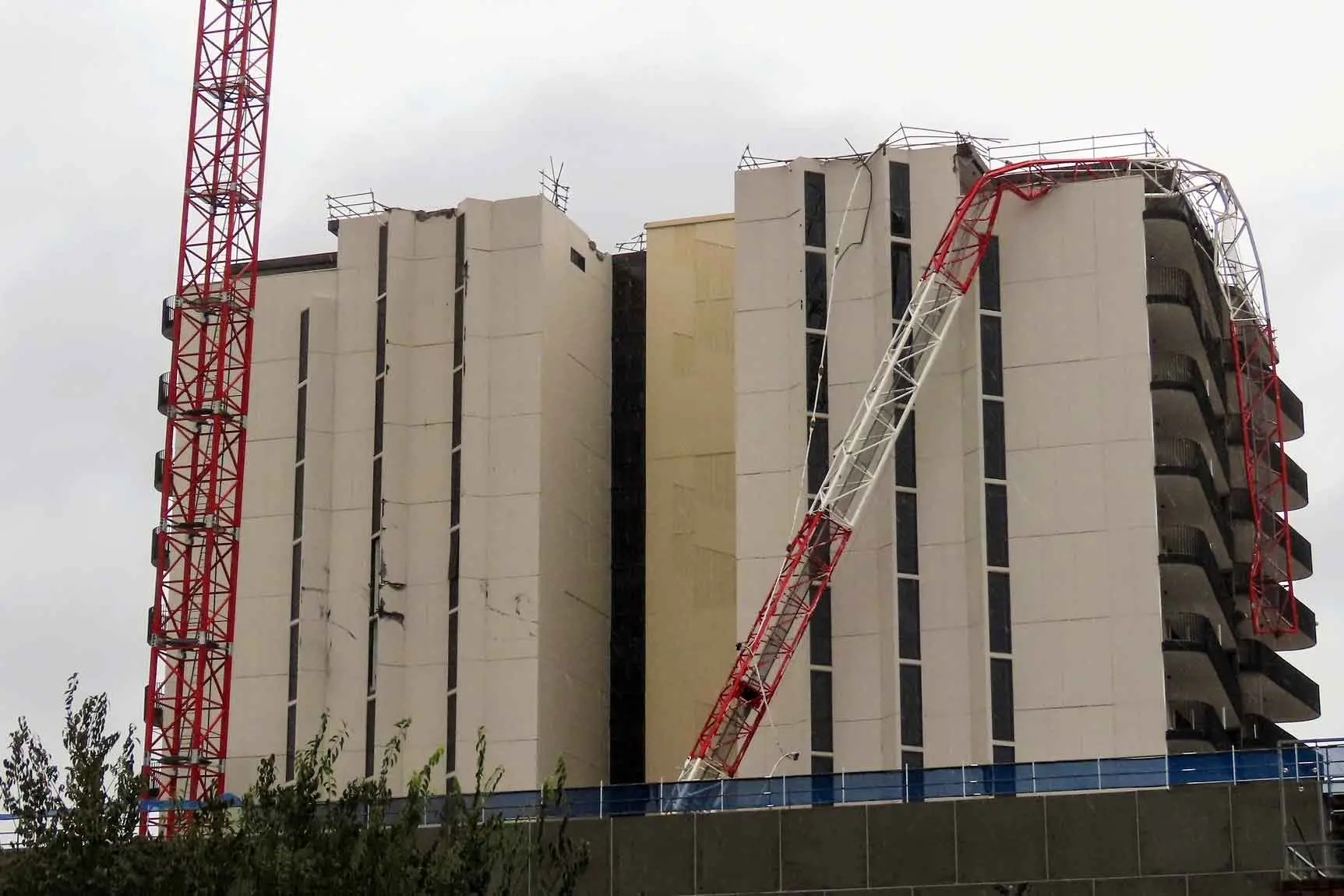 Crane collapses, trees downed as wild weather hits