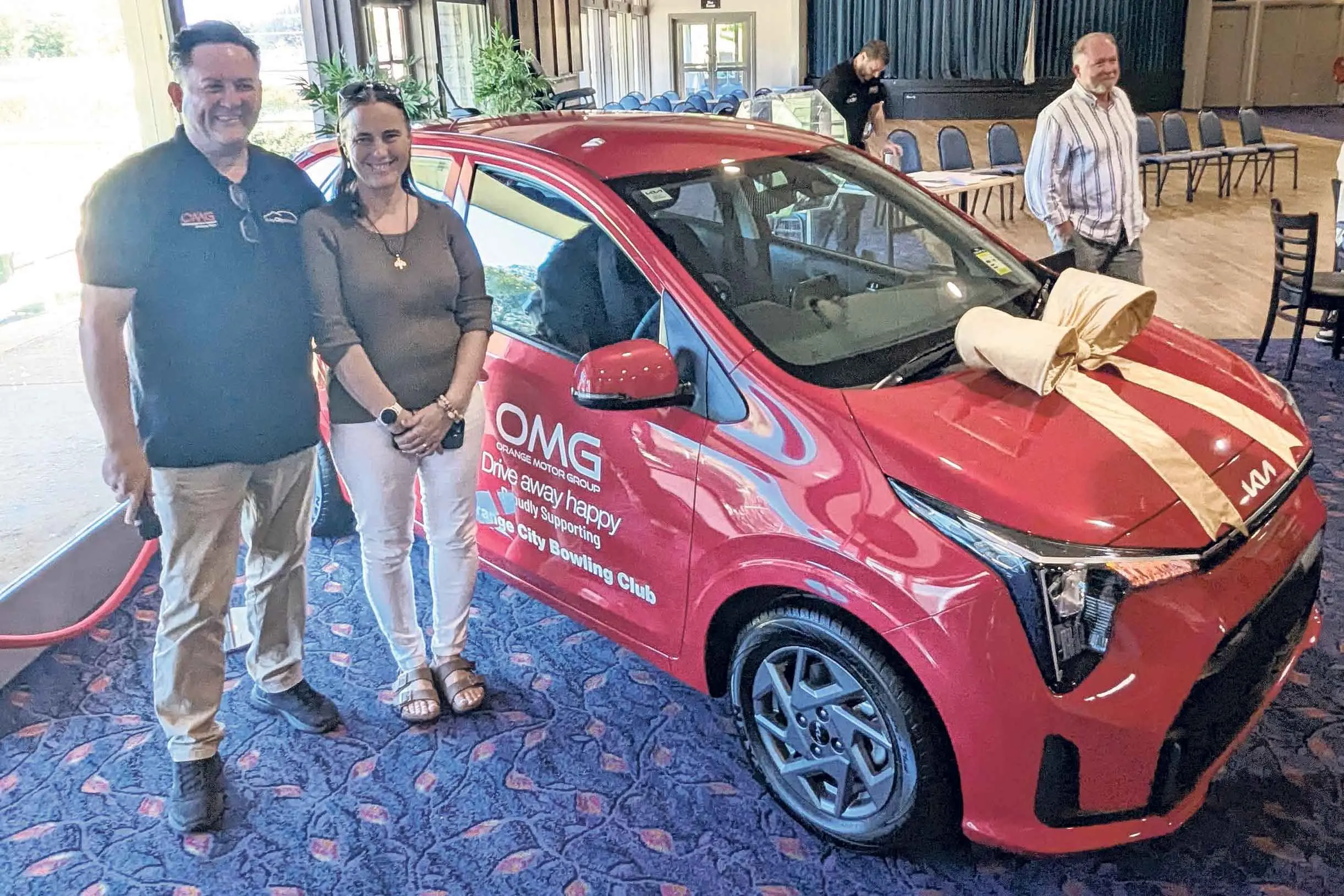 <p>Orange Motor Group sales manager Anthony Gersbach with the lucky winner of a new Kia Picanto Sport, Melissa Macdouall.</p>\\n