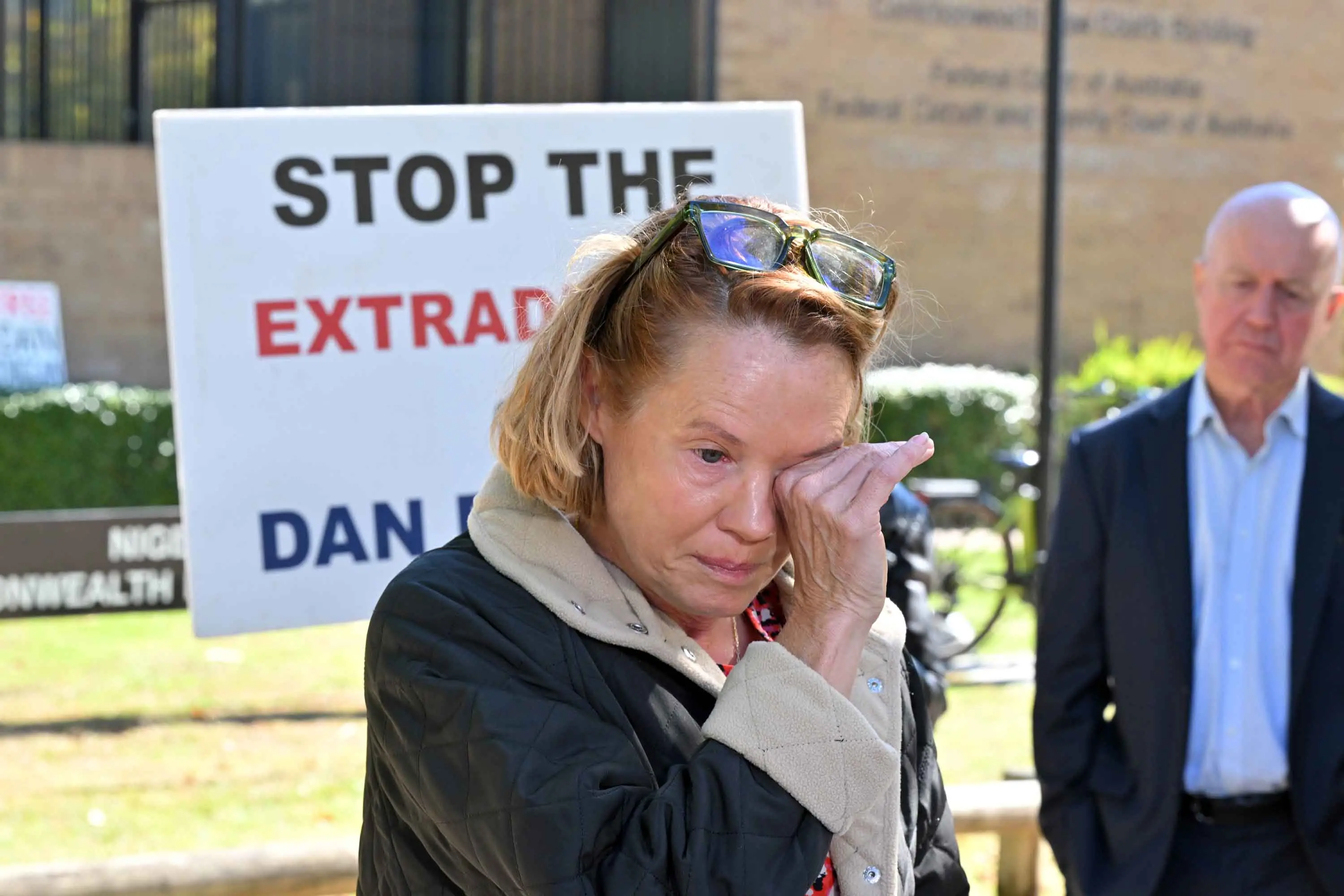 <p>Saffrine Duggan, wife of former U.S. Marine pilot Daniel Duggan, reacts outside the ACT Federal Court in Canberra on Thursday, April 16, after its decision against Mr Duggan\\'s legal battle against extradition. Photo: AAP/Mick Tsikas</p>\\n