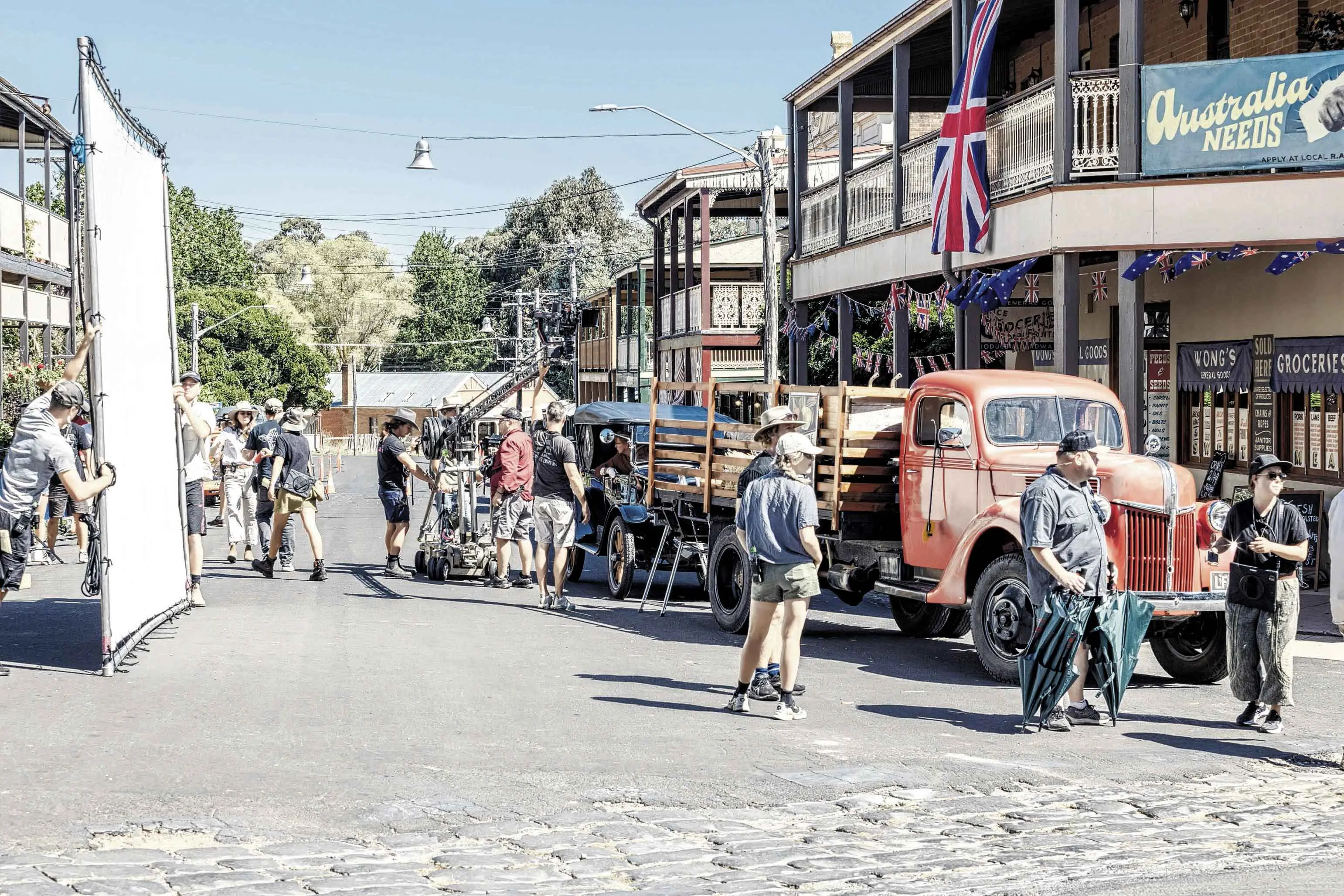 <p>Due to its largely intact Victorian-era main street, Millthorpe has been used extensively in film and television productions. Photo shows filming on the SBS WWII drama series, While The Men Are Away.</p>\\n