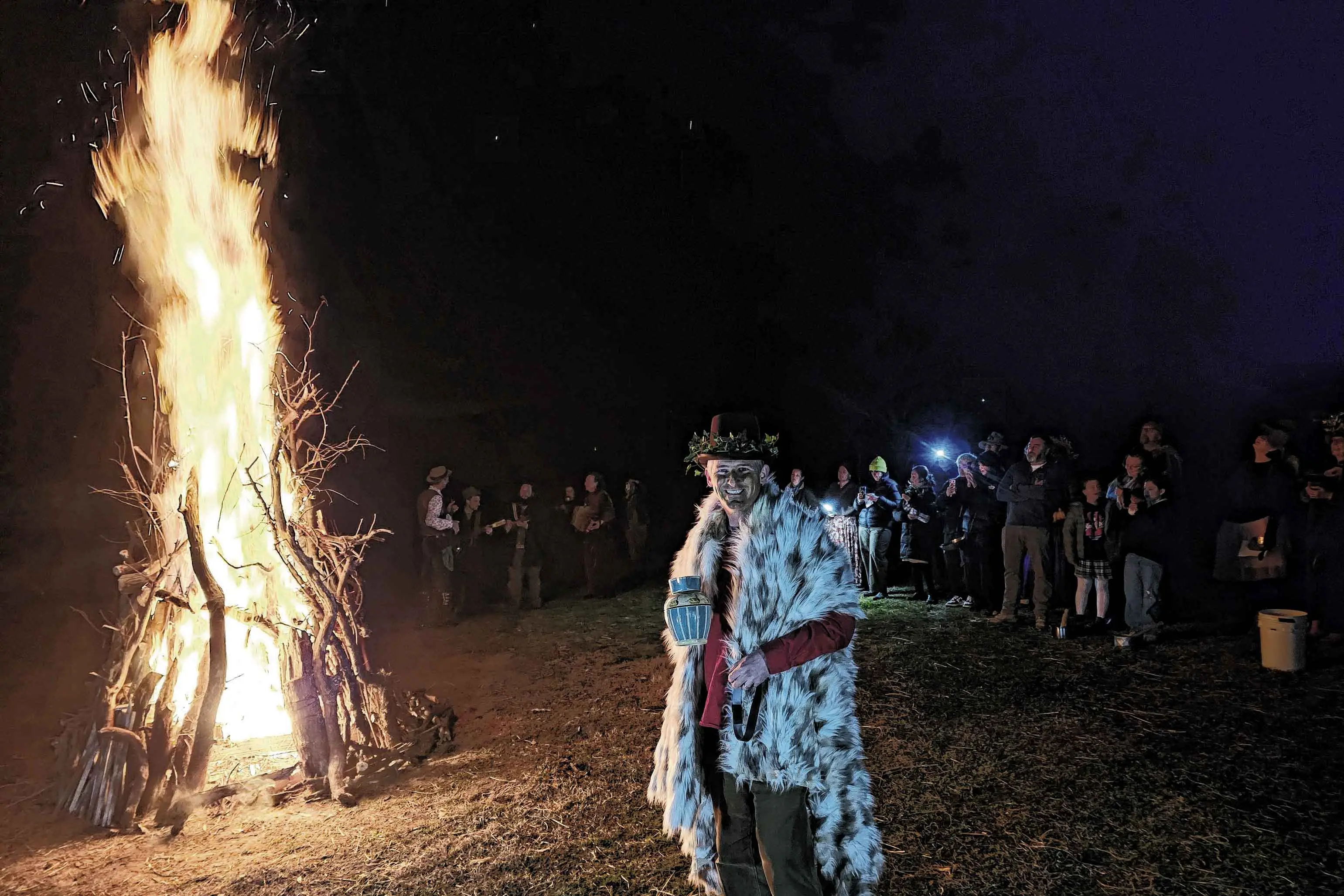 <p>Cidery co-owner Nick Geoghegan with the cider jug at the fire! Photo: Supplied. </p>\\n