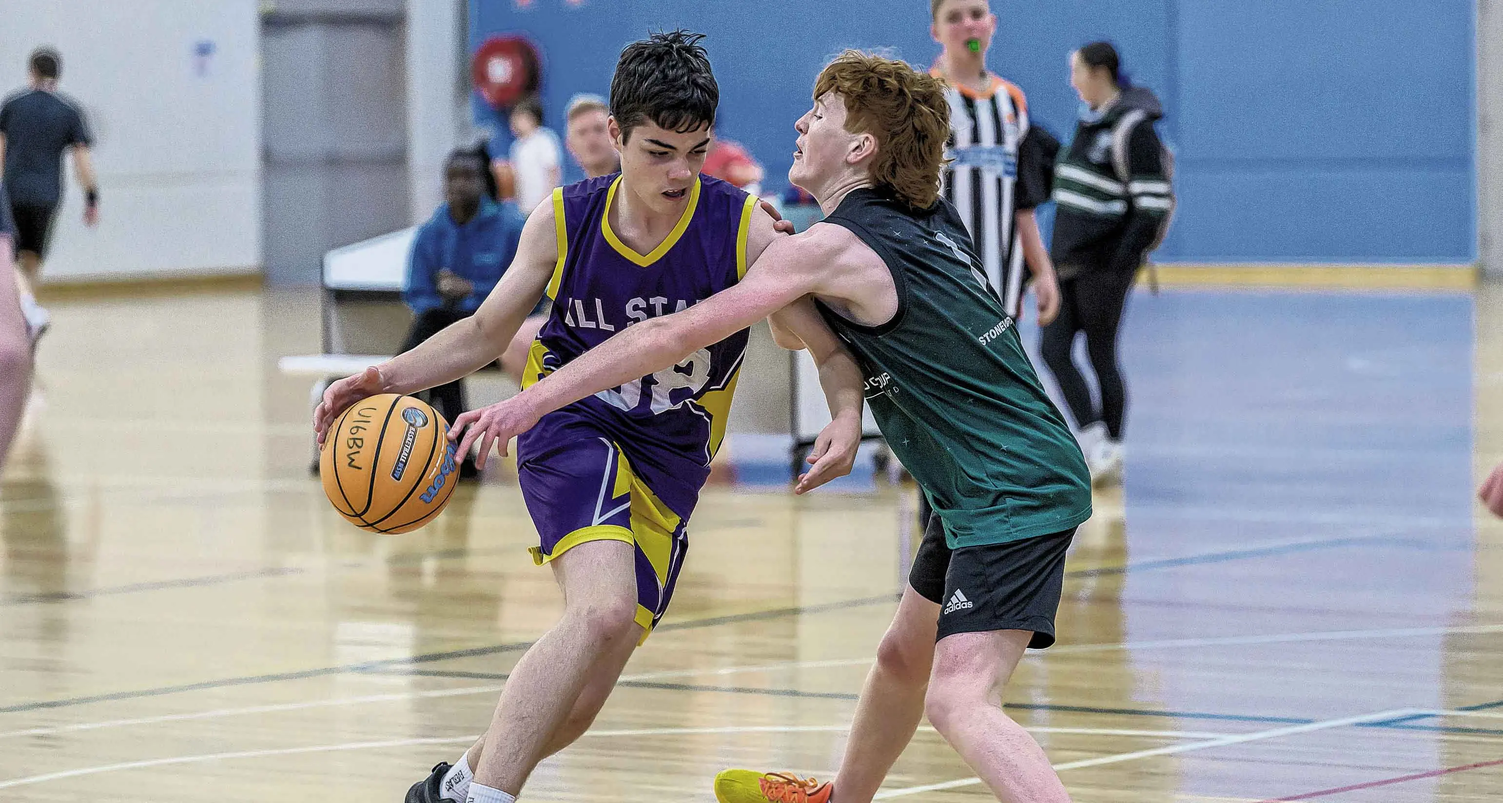 Basketball boys bounce back after court leaks delay games