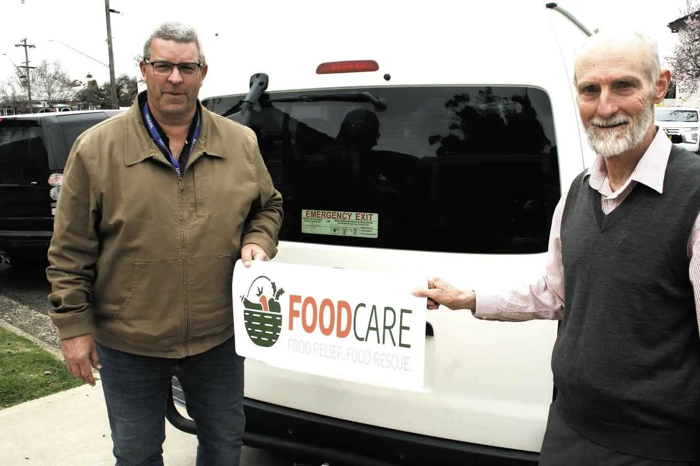 <p>Their own set of wheels! New signage for the Toyota Hiace donated by NDIS provider, Kirinari, with Jason Dawson, and FoodCare vice president, Lee Cook. Photo: Orange City Life.</p>\\n